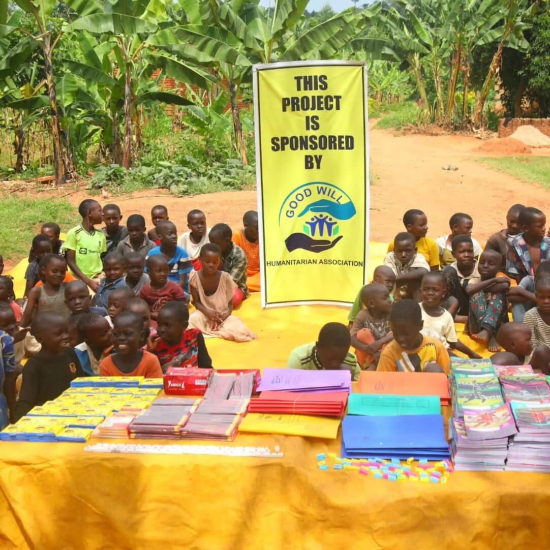 Children gathered at a school-supplies distribution table